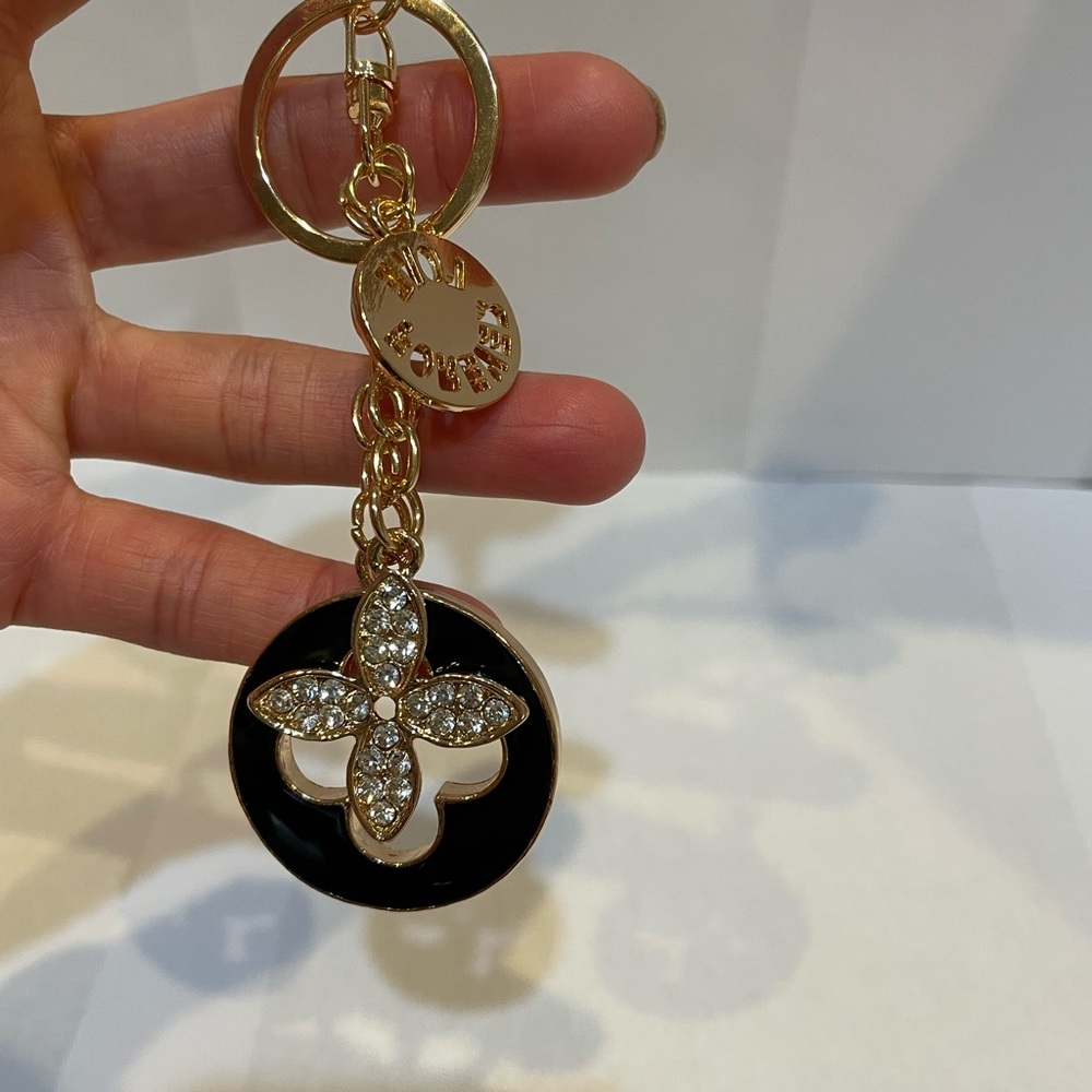 New! Unbranded black enamel clover keychain